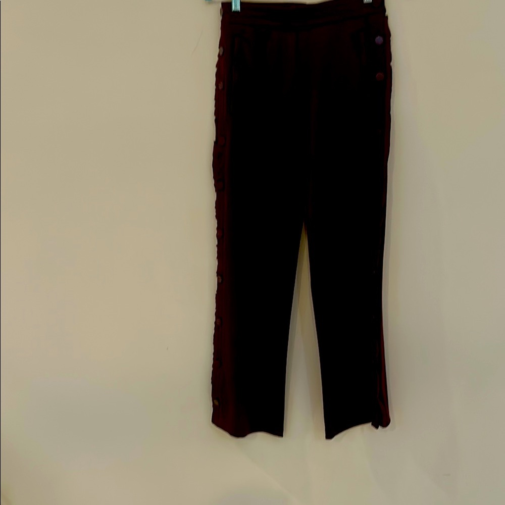 Tory Burch pants with decorative ruffles and buttons.